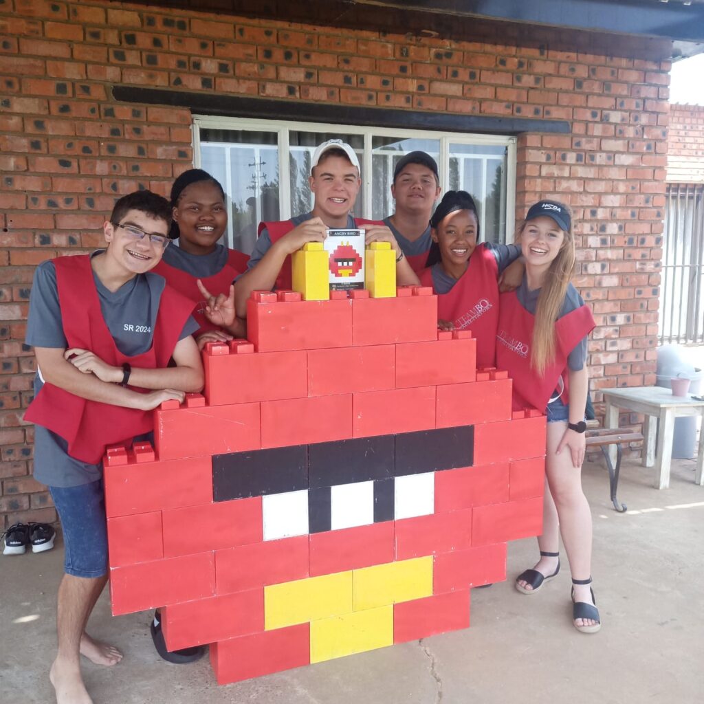 Grade 7 students engaging in outdoor team challenges