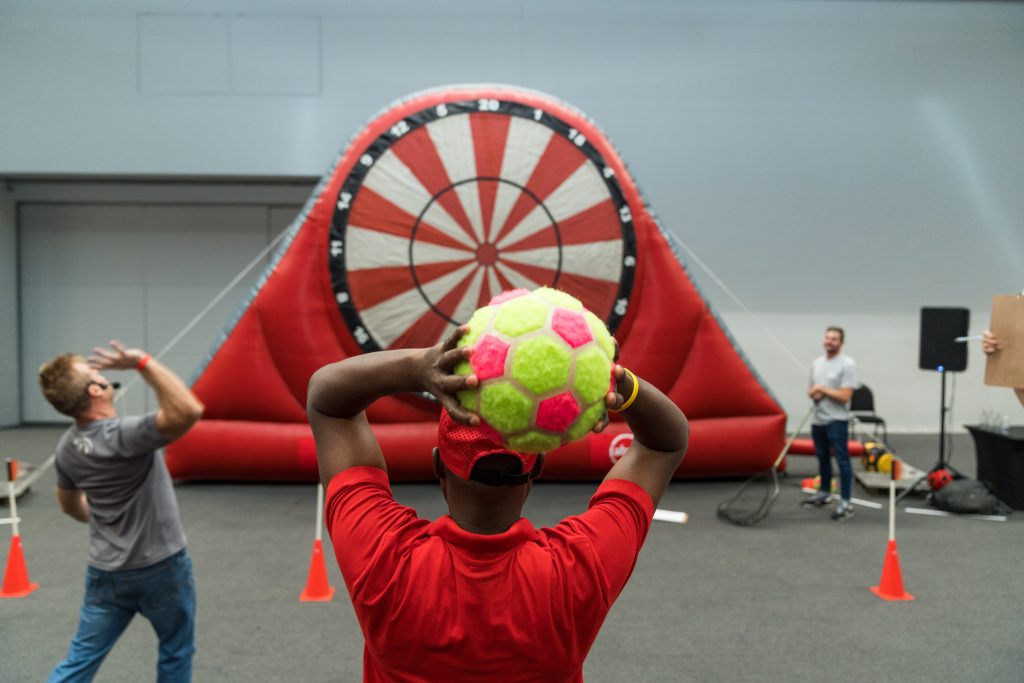 eambo facilitators guiding corporate leaders through interactive teambuilding exercises, fostering communication and problem-solving skills."