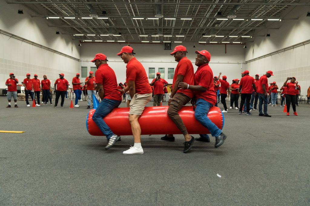 eambo facilitators guiding corporate leaders through interactive teambuilding exercises, fostering communication and problem-solving skills."