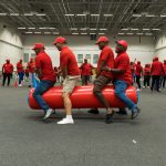 eambo facilitators guiding corporate leaders through interactive teambuilding exercises, fostering communication and problem-solving skills."