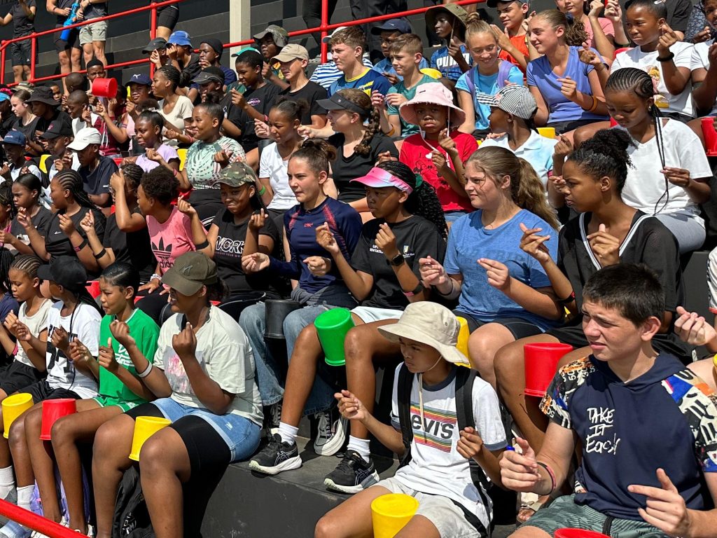 Grade 7 students participating in a fun and engaging teambuilding activity, working together to develop leadership, teamwork, and problem-solving skills in an outdoor setting.